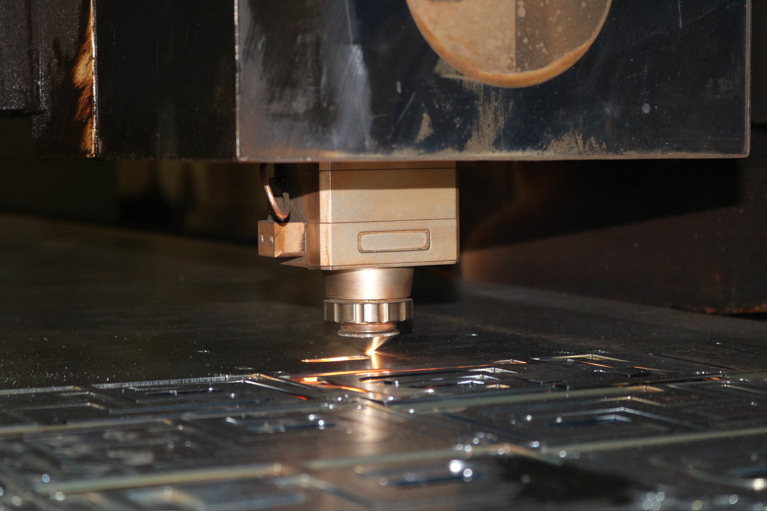 CNC machine cutting metal with a laser